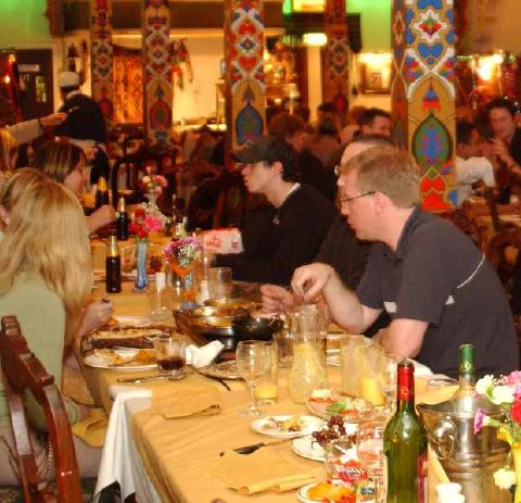 People eating and talking at a restaurant