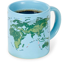 Mug that shows sea level change as warm liquid is poured into it demonstrating the effects of global warming.