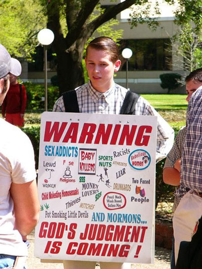 Christian religious nutjob spreads his faith with a sandwich board