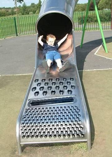 Photoshop job of a cheese grater mated to a children's slide - doesn't really exist.