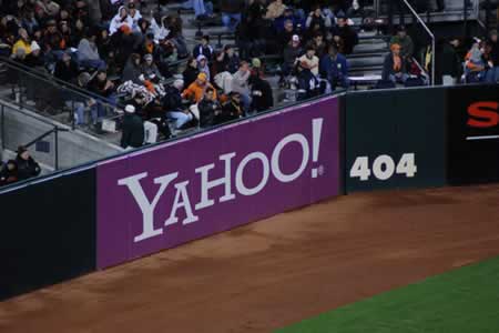 Yahoo Ad next to 404 foot marker in a ball park yielding 